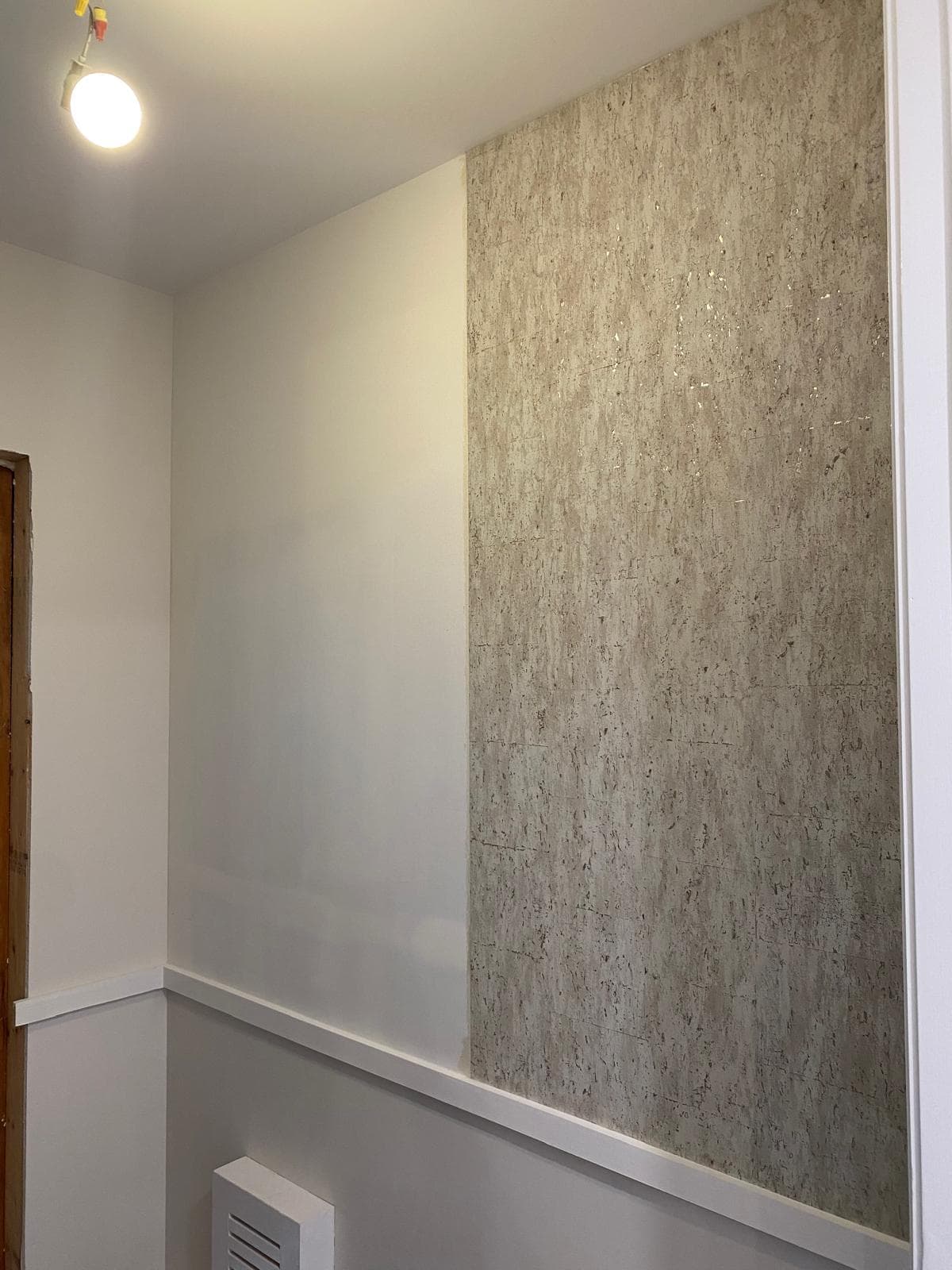 Luxury wallpaper installation in a New York apartment bedroom with seamless designer pattern finish.