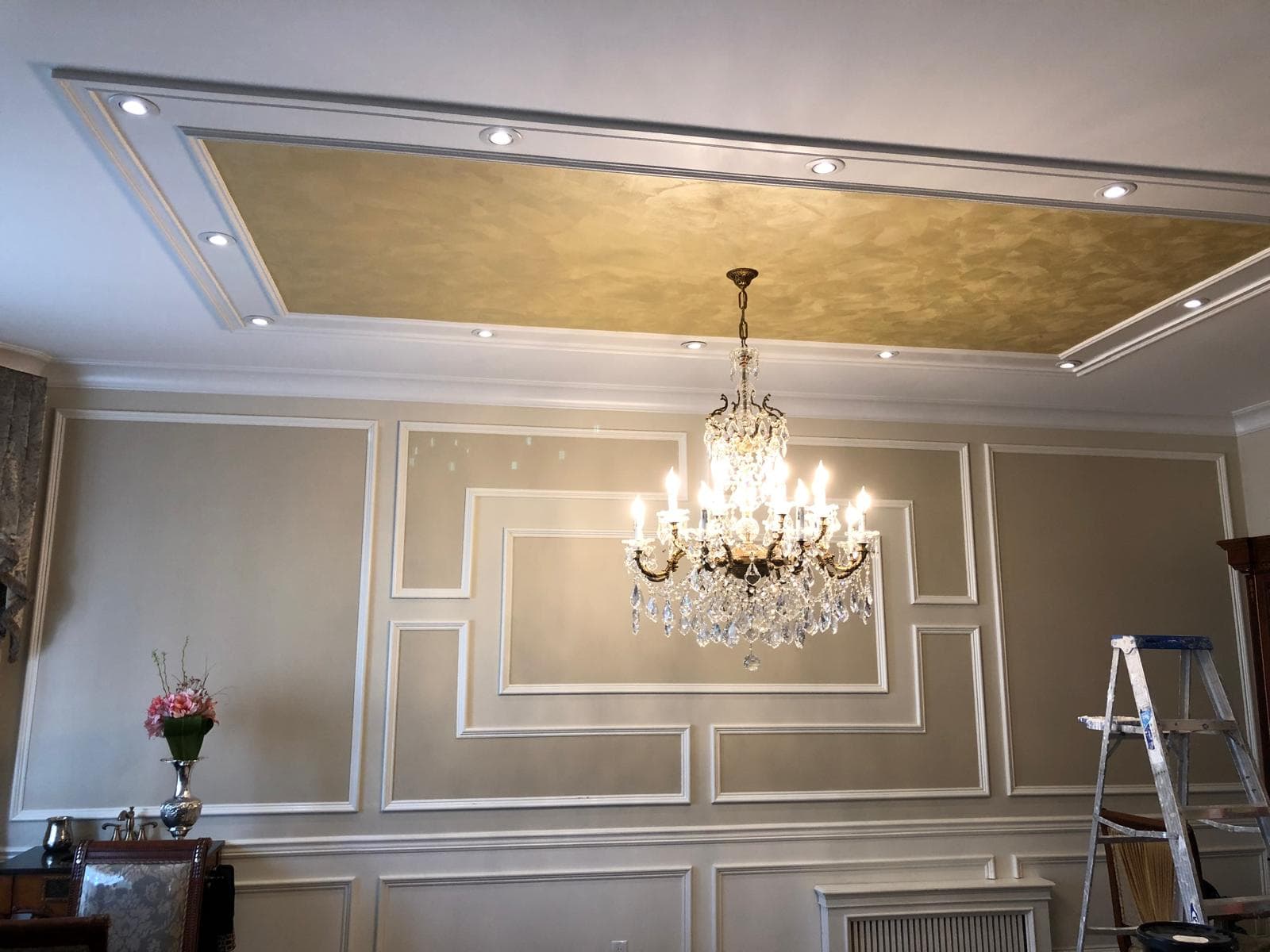 Modern living room in Brooklyn with freshly painted white walls and warm ambient lighting